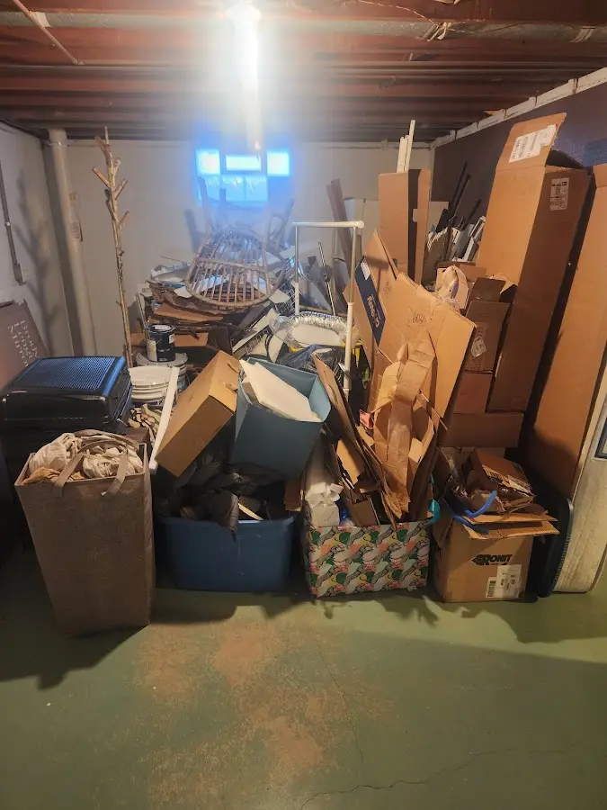 Roll-off dumpster container at job site for 15 Yard Dumpster Rental in Derry